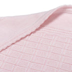 Close-up of pink textured fabric with a subtle pattern, lillelam