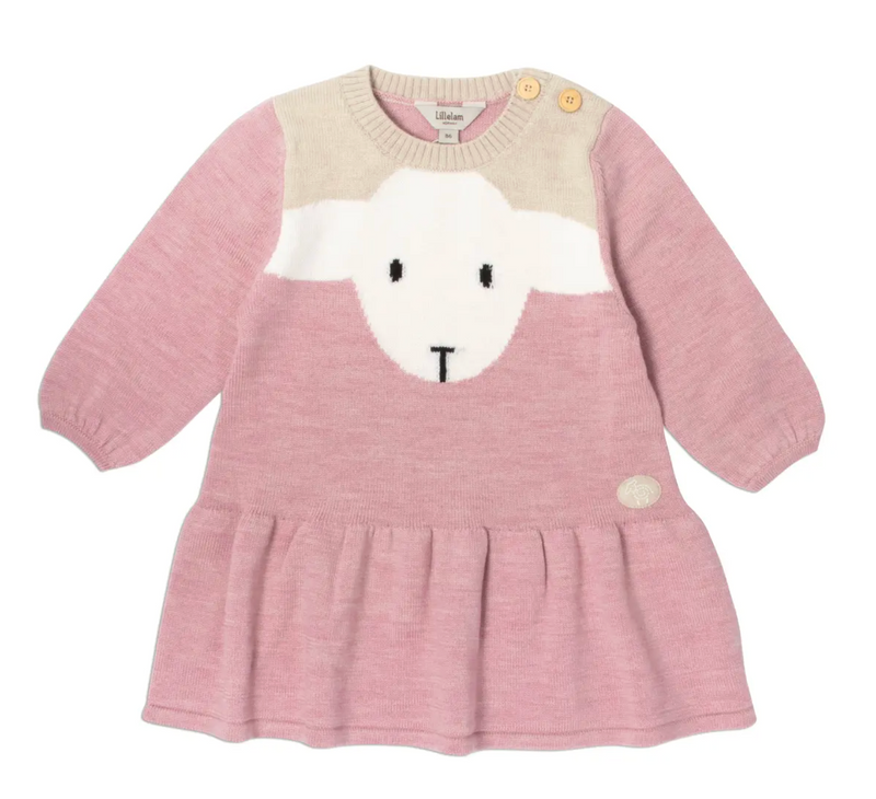 A pink long-sleeve baby knit dress with a sheep face motif on the front, featuring a cream yoke, yellow shoulder buttons, and a pleated hem, lillelam, wool, lammi dress