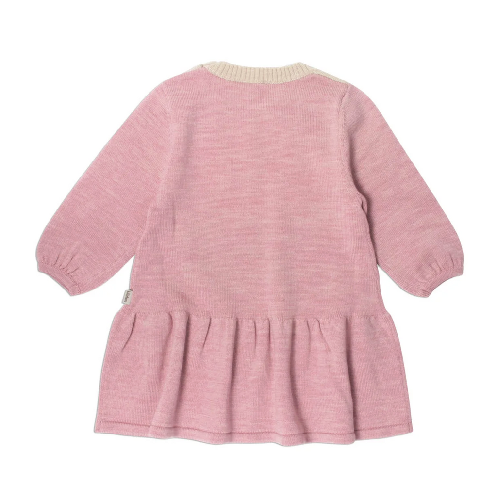 A pink knit long-sleeve dress with a gathered ruffle hem and elasticized cuffs, shown from the back on a white background. lammi dress, lillelam, merino wool