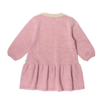 A pink knit long-sleeve dress with a gathered ruffle hem and elasticized cuffs, shown from the back on a white background. lammi dress, lillelam, merino wool